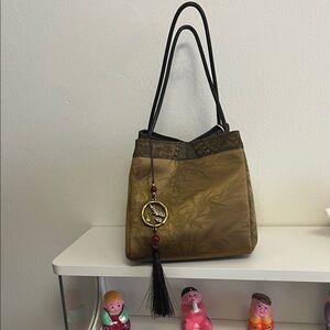 Elegant Brown Tote Bag with Tassel Accent
New with tags
